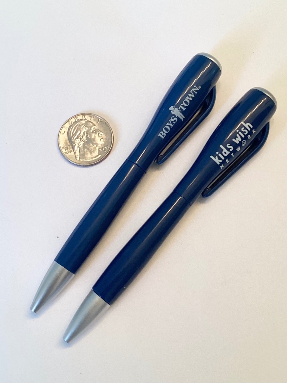 TWO FLASHLITE PENS…Boys Town and Kids Wish, smooth writing in blue ink.